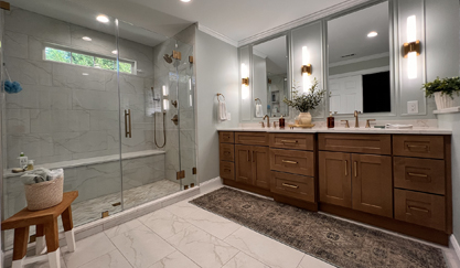 Modern bathroom with glass shower and wooden double vanity