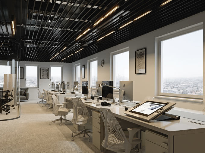 Modern open-plan office with desks, computers, and city views