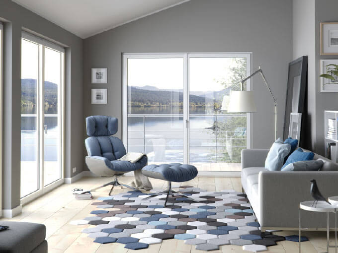 Modern gray living room with lake-view windows